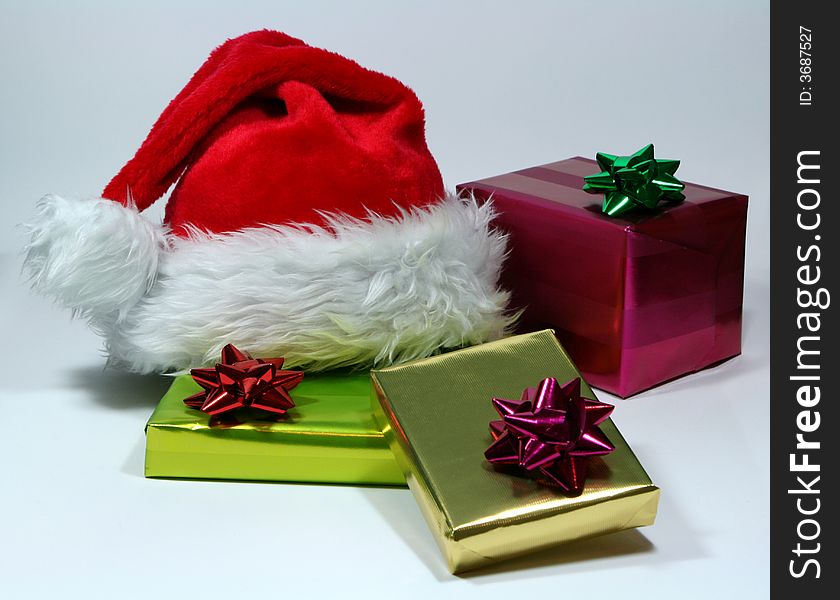 Gift with santa's hat on white background. Gift with santa's hat on white background