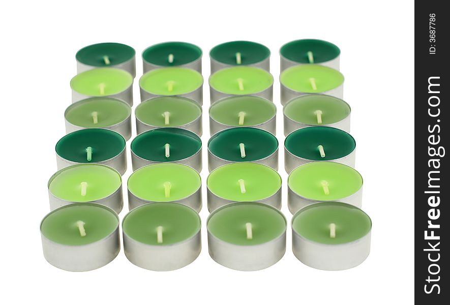 Flavored green candles isolated on white