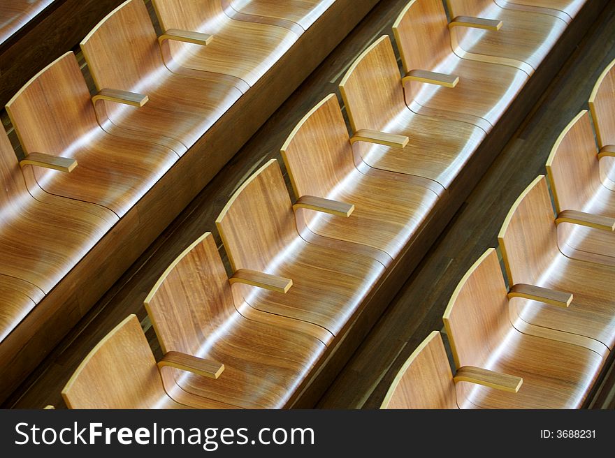 A theatre of wooden chairs. A theatre of wooden chairs