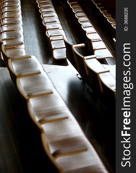 A theatre of wooden chairs. A theatre of wooden chairs