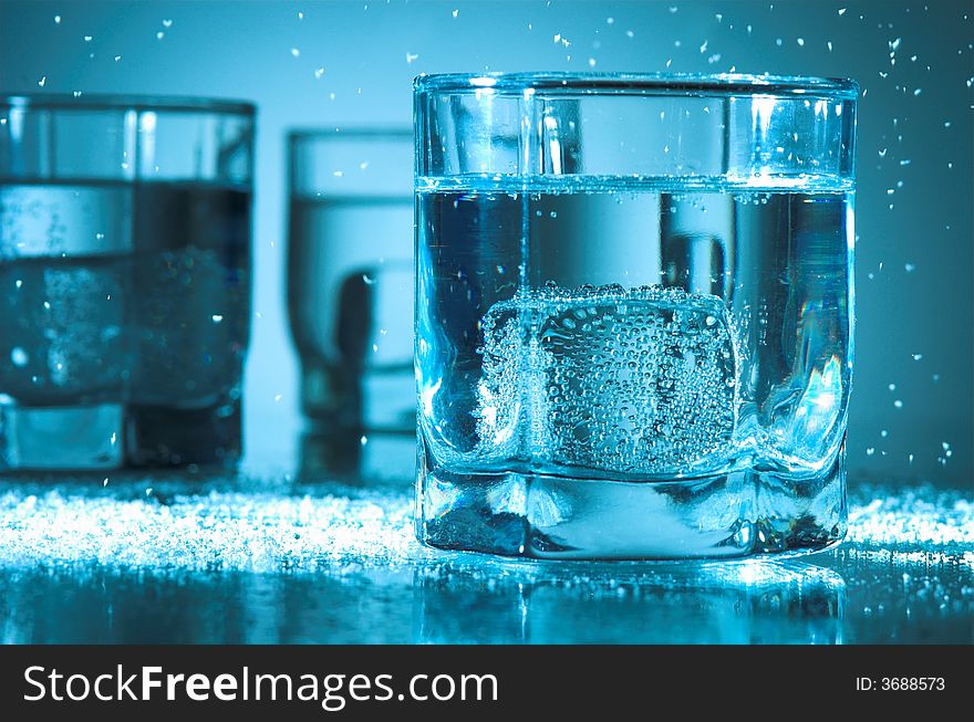 Three glasses with ice and water. Three glasses with ice and water