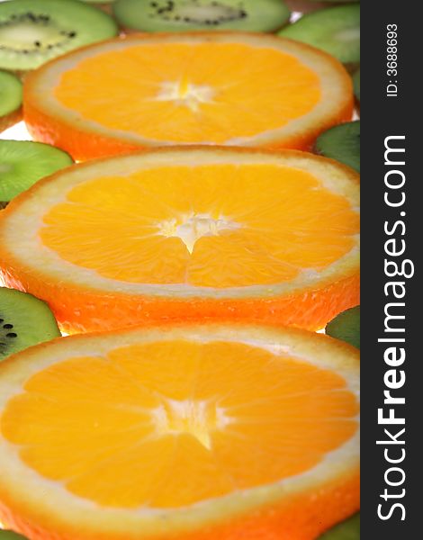 Orange and kiwi slices background