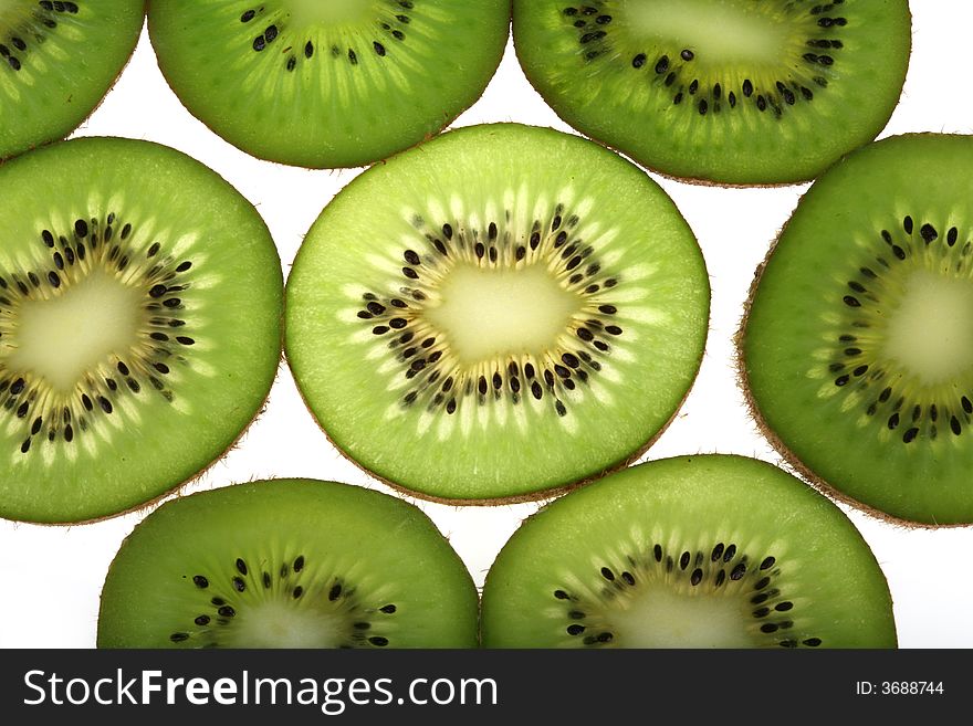 Slices of fresh kiwi background. Slices of fresh kiwi background