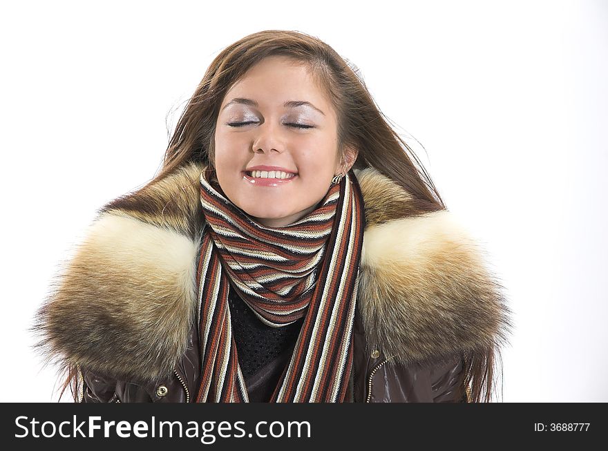 A smiling beautiful girl in winter clothes