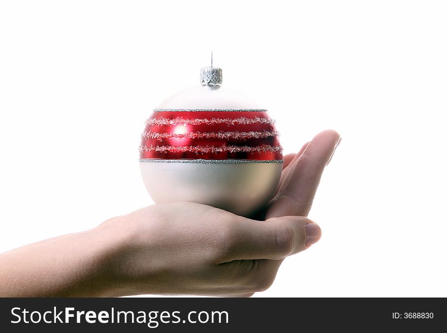 A young woman holds a christmas glitter ball. Isolated over white with a lot of space for text!. A young woman holds a christmas glitter ball. Isolated over white with a lot of space for text!