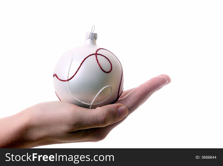 A young woman holds a christmas glitter ball. Isolated over white with a lot of space for text!. A young woman holds a christmas glitter ball. Isolated over white with a lot of space for text!