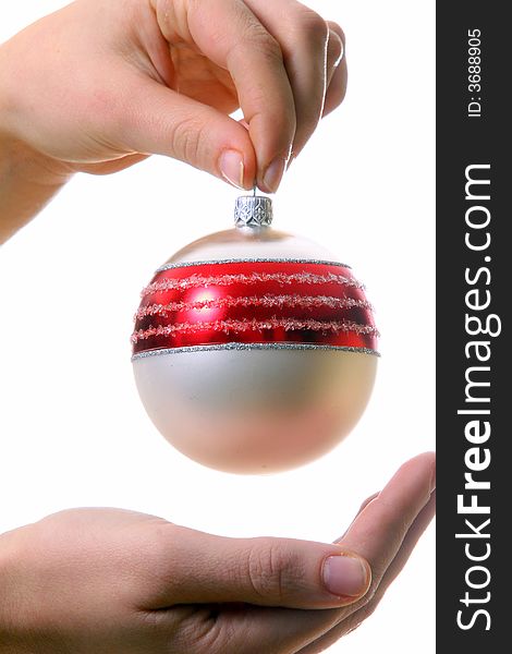 A young woman holds a christmas glitter ball. Isolated over white with a lot of space for text!. A young woman holds a christmas glitter ball. Isolated over white with a lot of space for text!