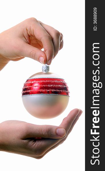 A young woman holds a christmas glitter ball. Isolated over white with a lot of space for text!. A young woman holds a christmas glitter ball. Isolated over white with a lot of space for text!