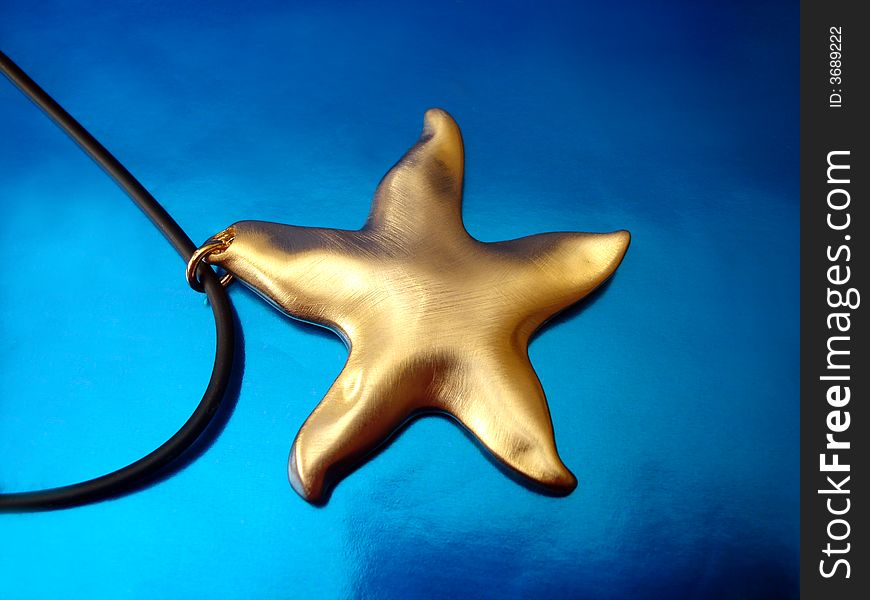 Golden Star On Blue Background