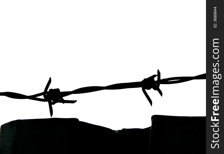 Portrait of barbed wire fence and wall