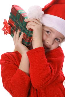 Little Girl Shakin A Present Vertical Royalty Free Stock Images