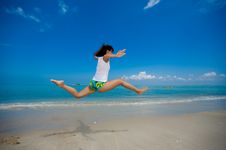 Happy Jump At The Beach Stock Images
