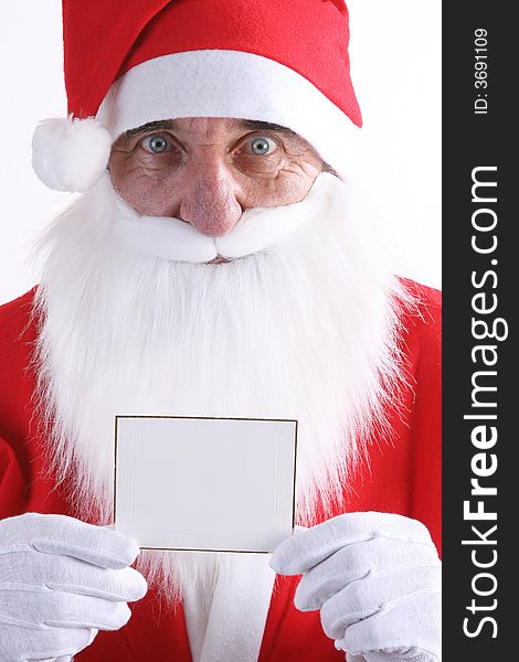 Santa holding a small blank white card. Santa holding a small blank white card