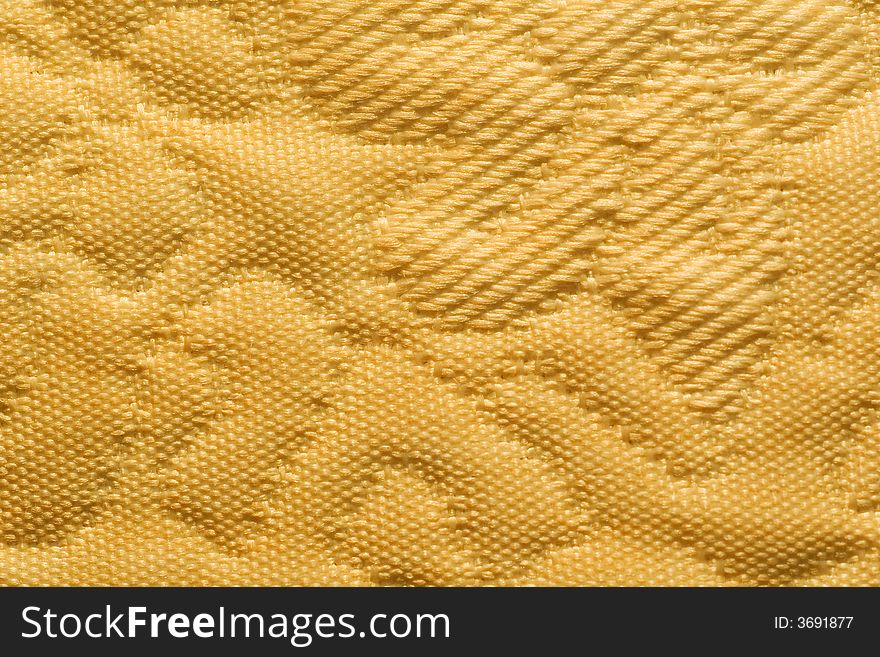 Abstract yellow embossed textile background