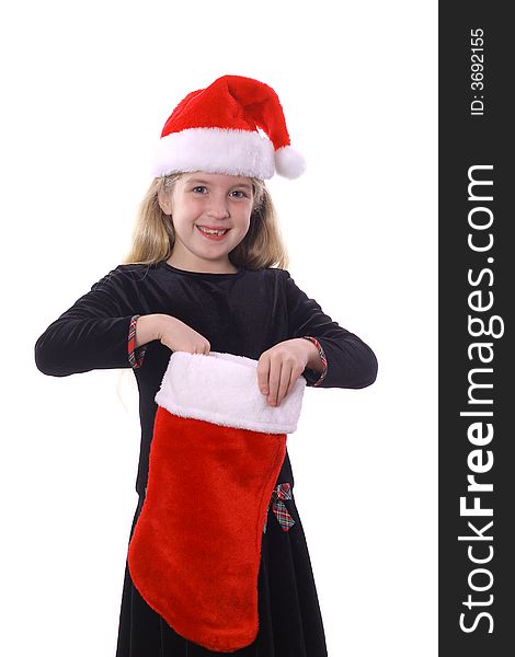 Photo of a child with santa hat & stocking