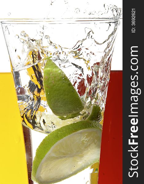 Glass with juice and lemon on the white background