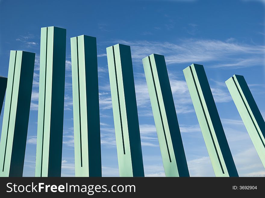 Picture of an abstract pillar like structures against a blue sky. Picture of an abstract pillar like structures against a blue sky