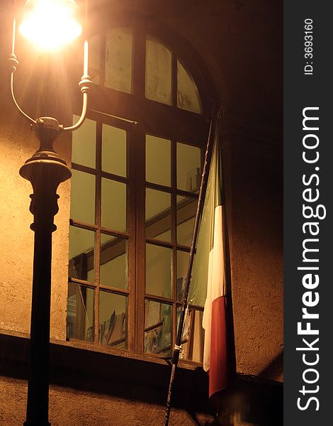 Window with lamppost and Italian flag - Night - Rome Italy Europe. Window with lamppost and Italian flag - Night - Rome Italy Europe