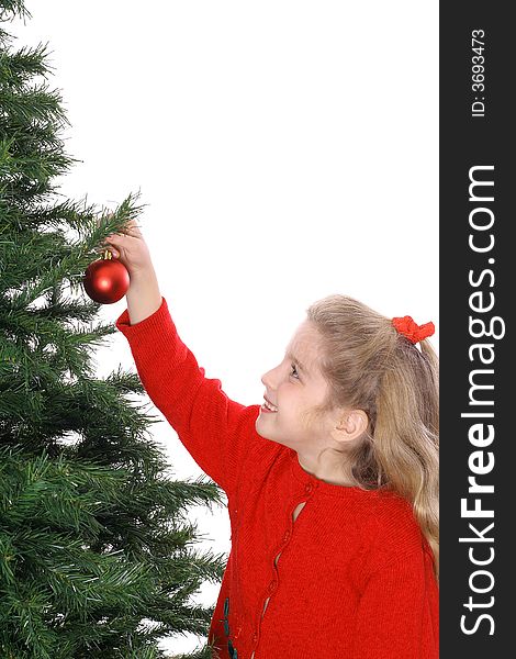 Child Hanging Ornament On Tree Vertical