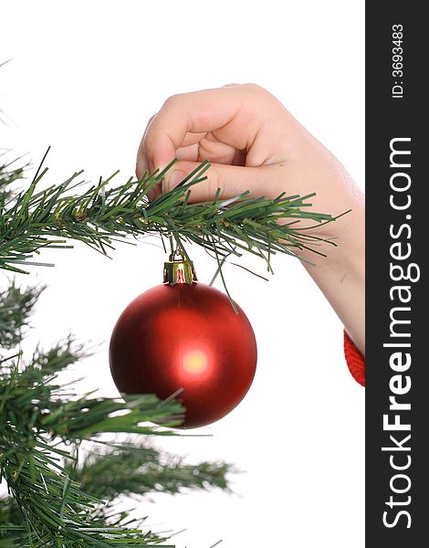 Shot of a Childs hand hanging ornament