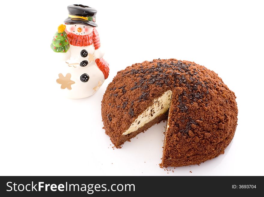 Chocolate cake on white background with snowman, christmas