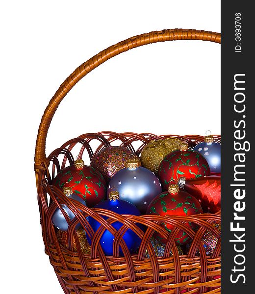 Basket with christmas balls, isolated on white background