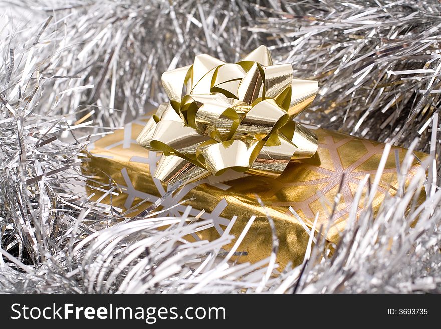 Golden present,gift, wrap, with decorative ribbons. Golden present,gift, wrap, with decorative ribbons