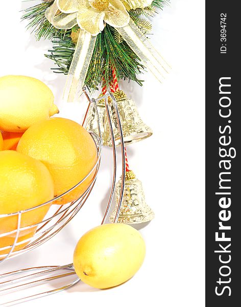 Christmas decoration bells and citrus fruits