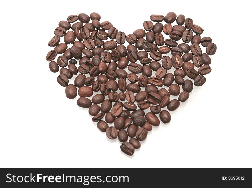 Heart from coffee grains on a white background