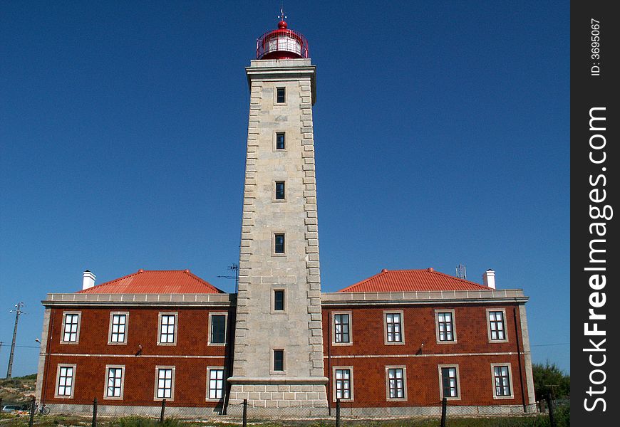 Photo of lighthouse and is adjacent buildings