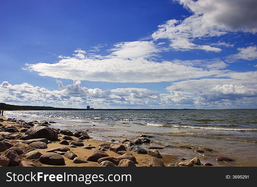 Landscape with blue sky, clouds, stones and sea. Landscape with blue sky, clouds, stones and sea