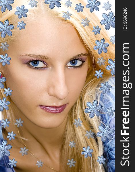 Beautiful blond girl with snowflakes