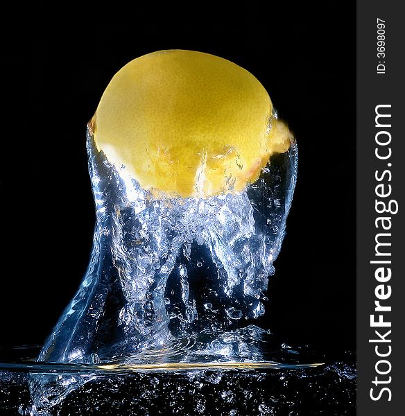 Scene of the lemon in water on black background