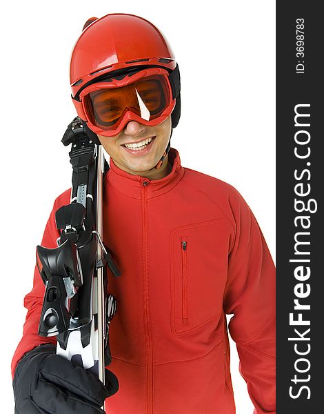 Smiling skier dressed ski overall. He holding on shoulder skis. He's on white background. Smiling skier dressed ski overall. He holding on shoulder skis. He's on white background