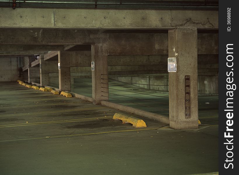 An empty parking garage with compact only sign