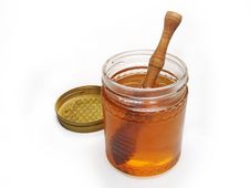 HONEY GLASS JAR WITH WOODEN DRIZZLER Stock Photos HONEY GLASS JAR WITH WOODEN DRIZZLER Stock Photos