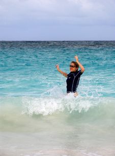 Girl Splashes In Waves Royalty Free Stock Photo