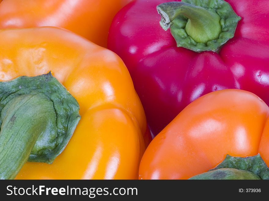 Several peppers of varying colors. Several peppers of varying colors