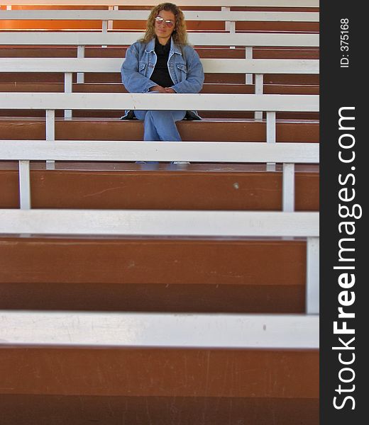 Woman Sits by Herself. Woman Sits by Herself