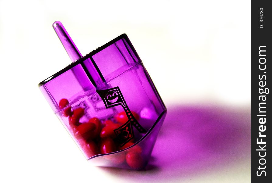 Plastic Purple Dreidel with candy inside