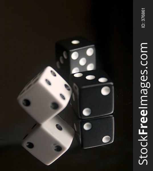 3 Dice on reflective surface