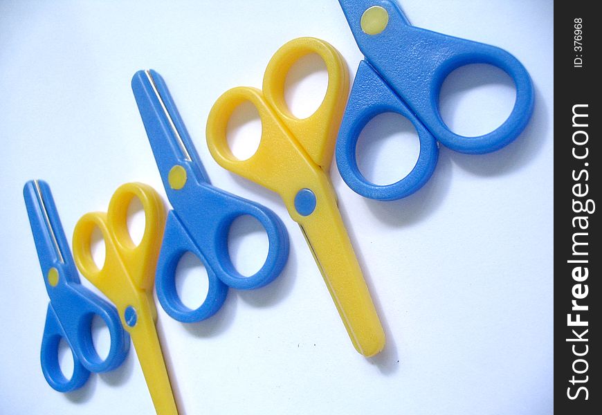 Blue and yellow scissors. Blue and yellow scissors