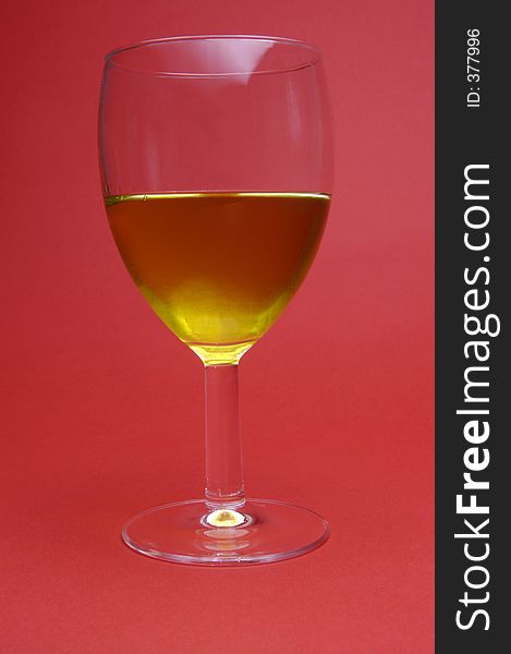 Wine glass on red background