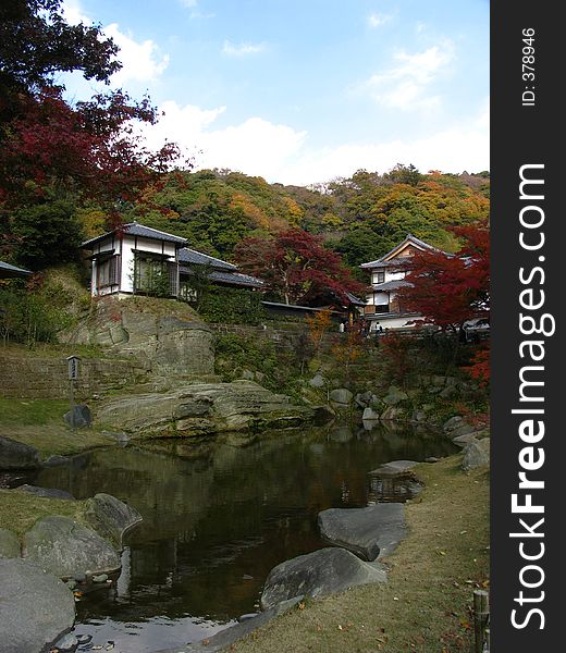 A picturesque scene at Kamakura, Japan. The Autumn leaves fill the picture with warmth whilst the blue sky presents a relaxed atmosphere.