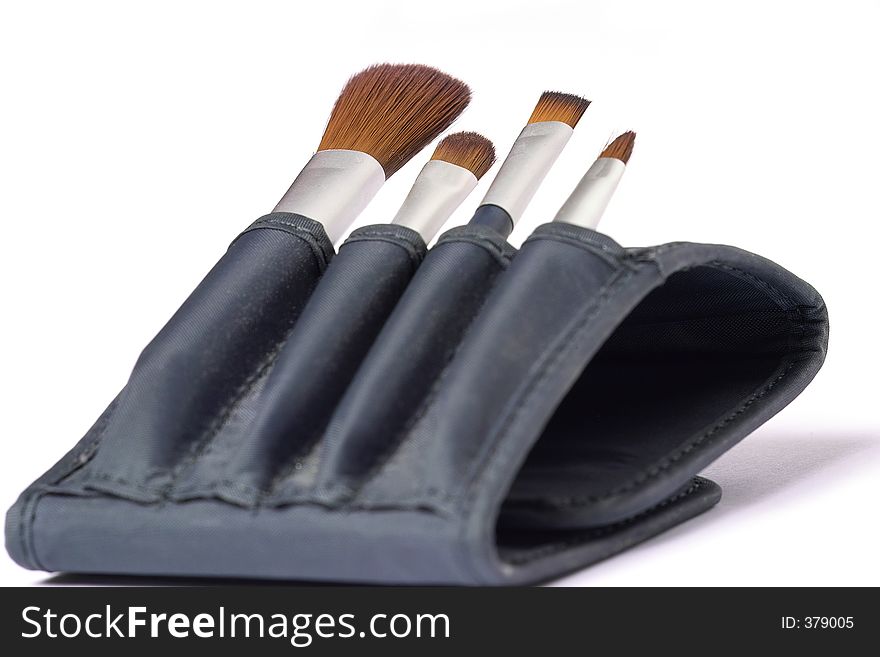Travelling set of four make up brushes with mirror. Travelling set of four make up brushes with mirror
