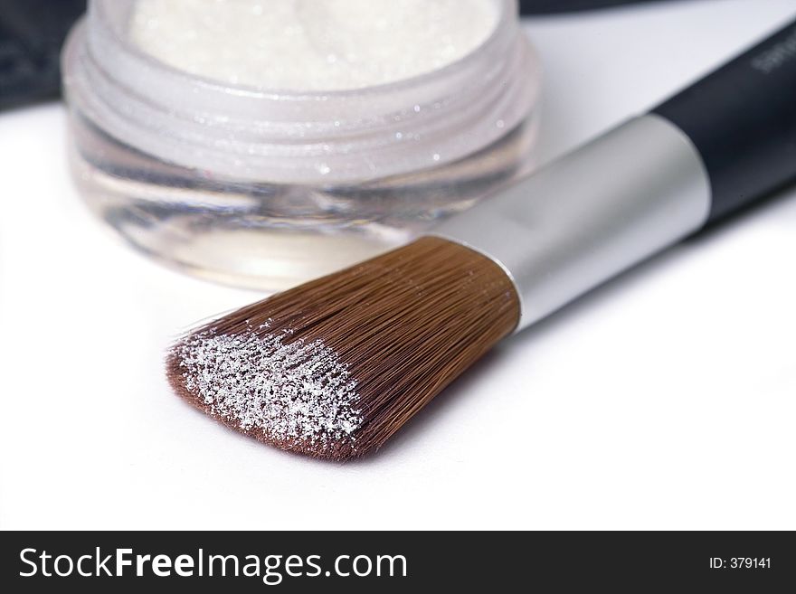 Make up brush with glittering perl powder. Make up brush with glittering perl powder