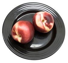 Fresh Peaches On A Black Plate Royalty Free Stock Image