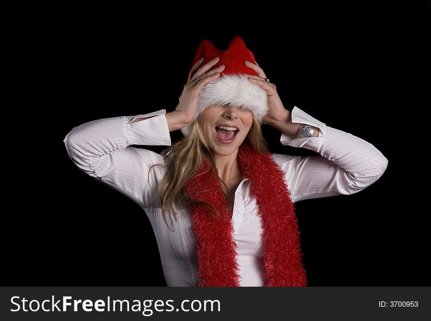 Girl in a Santa hat and boa having fun