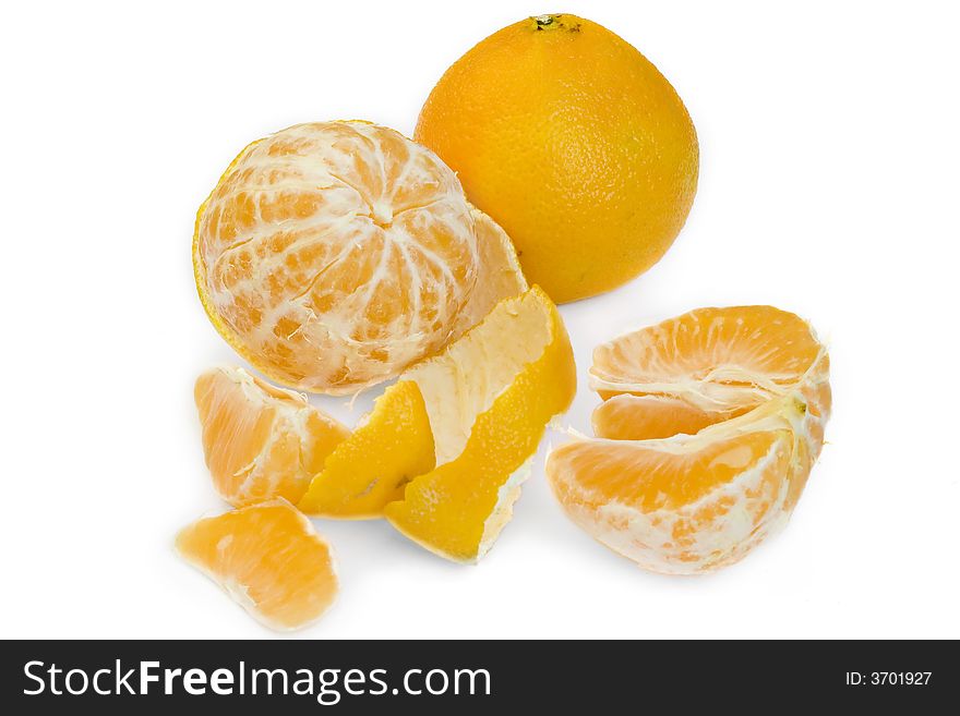 Still life of solid and peeled tangerines in white background. Still life of solid and peeled tangerines in white background