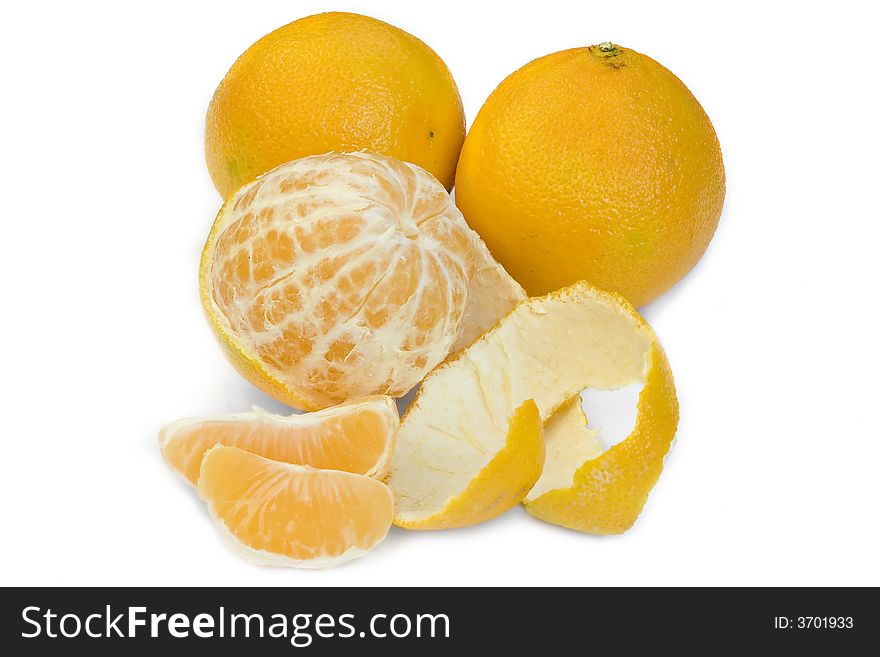 Still life of two solid ,half-peeled and cut in segments tangerines in white background. Still life of two solid ,half-peeled and cut in segments tangerines in white background